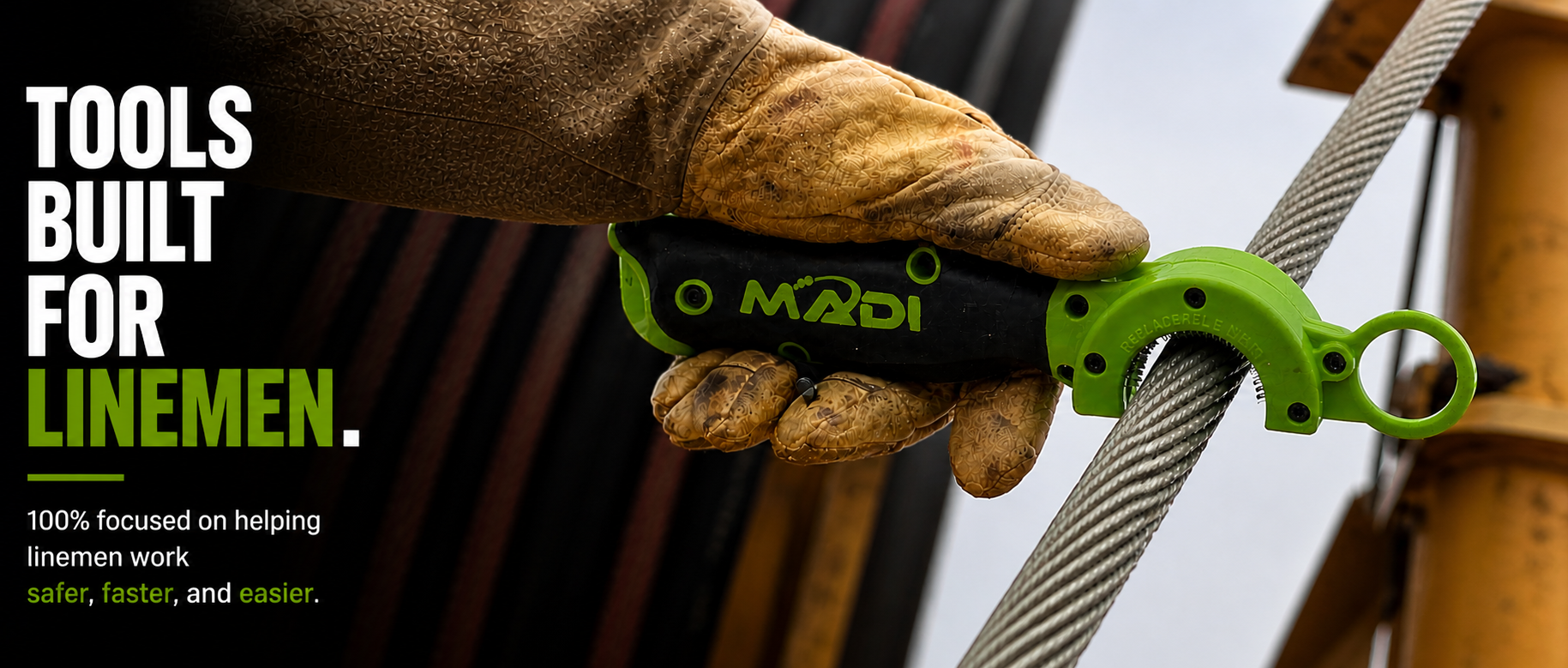 Hand wearing a brown glove holding a green tool with text about tools built for linemen.